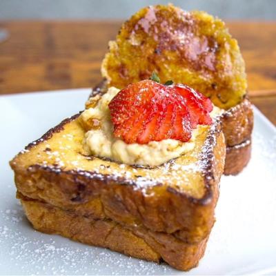 Toast - Creme Brulee French Toast topped with strawberries and powder sugar
