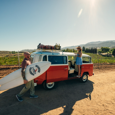 Couple in VW Bus for Waves to Wine campaign