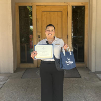 Marisol Ramos holding an award certificate