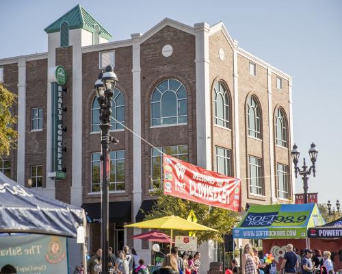 Vendors set up on street corners sell goods to customers