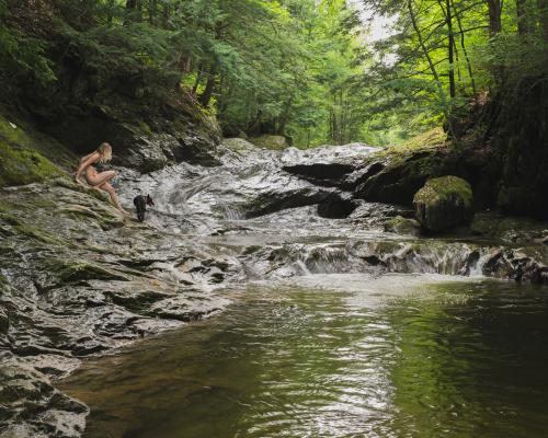 Lady swimming in a stream