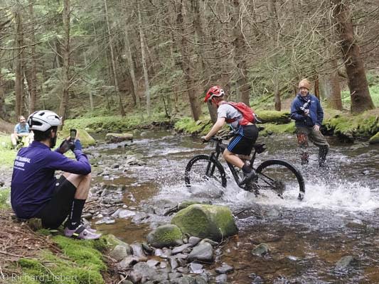 Cycling enthusiasts thru creek
