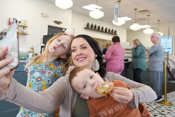 Mom and kids taking selfie at Parlor Doughnuts
