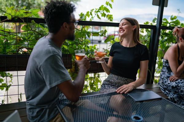 Man and woman drink beer at Tractor Brewery Nob Hill