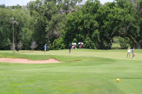 people playing golf at ross rogers gold complex wild horse course