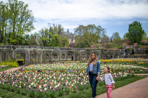 Mother and daughter standing in the gardens at Biltmore Estate