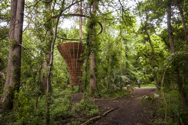 Canopy Tower sculpture by John Grade in forest at Laguna Gloria