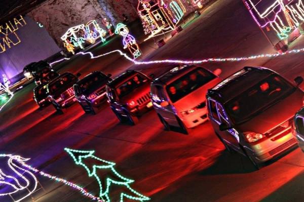 Cars driving through underground light show, Lights Under Louisville
