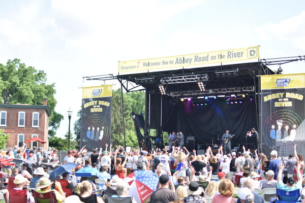 Crowds enjoy an outdoor concert at Abbey Road on the River in Jeffersonville, IN