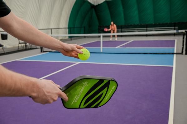 Serving a pickleball