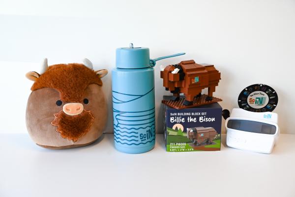 SoIN Fun Trail prizes for 2026. Left to right: SoIN Squishable Bison, blue SoIN insulated water bottle, Billie the Bison Building Blocks Set, and SoIN Viewfiner.