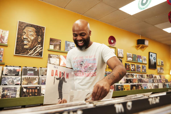 Artist CM Campbell shopping at a local record store