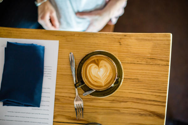 Cup of coffee with a heart design from Stauf's Coffee