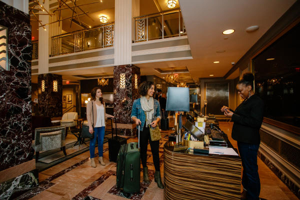 Woman checking in to Hotel LeVeque