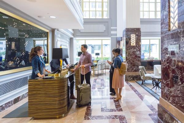 Hotel guests at lobby check-in