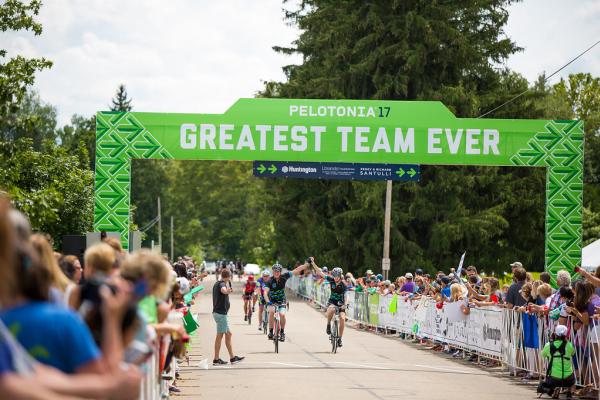 Two bike riders crossing the finish line during Pelotonia's Ride Weekend