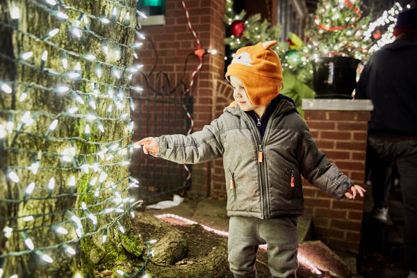 Child pointing at lights during Village Lights at Ohio Village