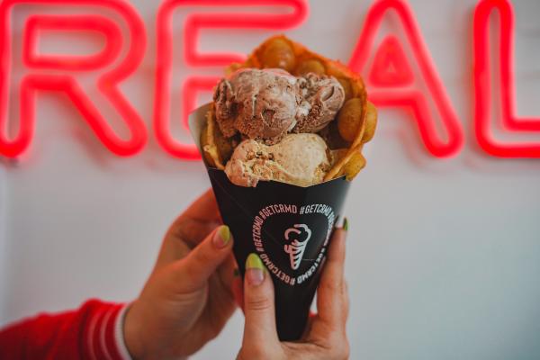 A person holding CRMD Ice Cream