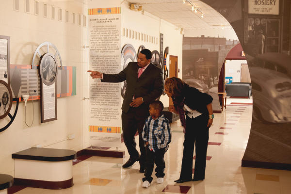 A family viewing art at the King Arts Complex