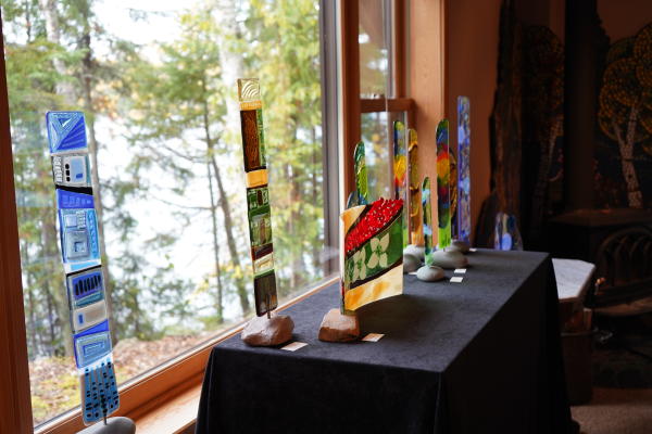 Glass sculptures sitting in a window