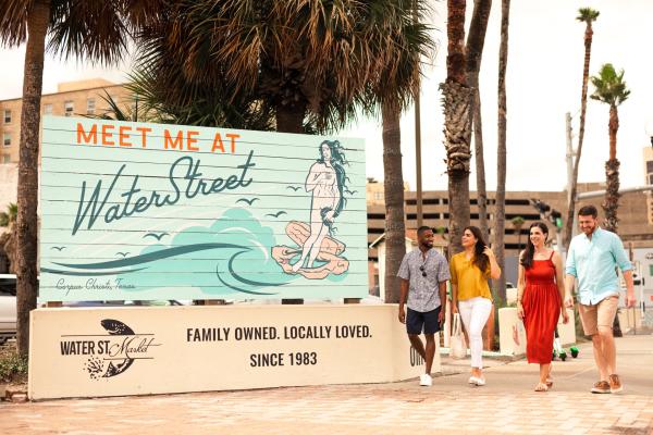 A group walking by the Water Street.