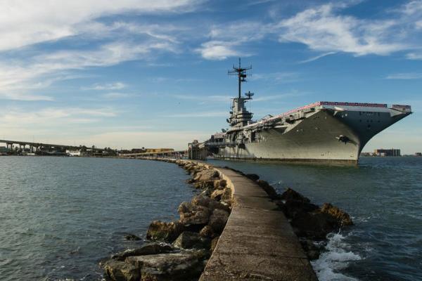Exterior of the USS Lexington next to a pathway