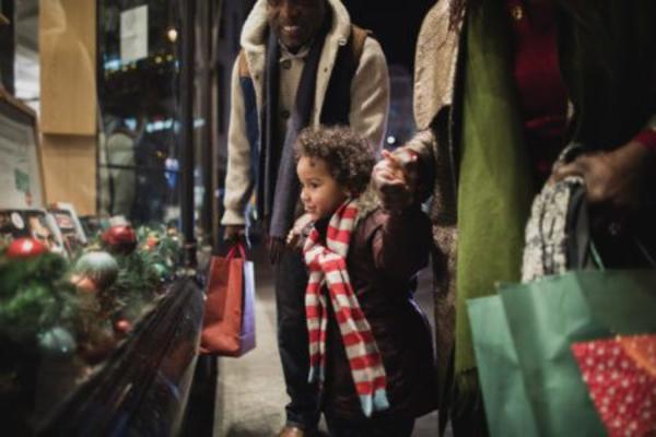 Child looking in Christmas Window