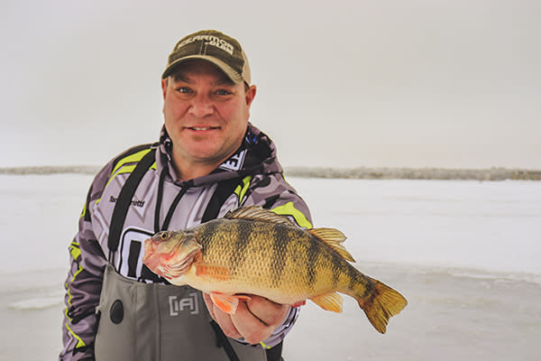 Fisherman holding Perch