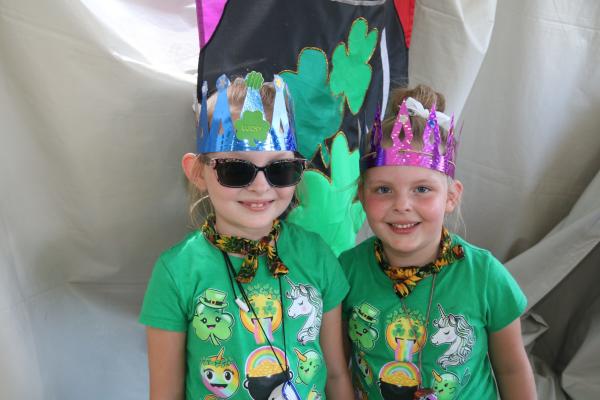 Two kids dressed in green with handmade crowns at the Dublin Irish Festival