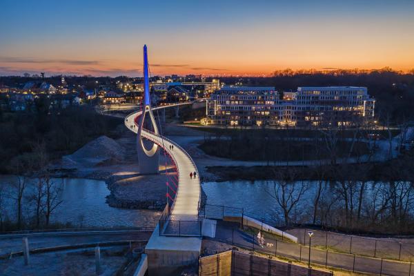 The Dublin Link pedestrian bridge lit red white and blue at night