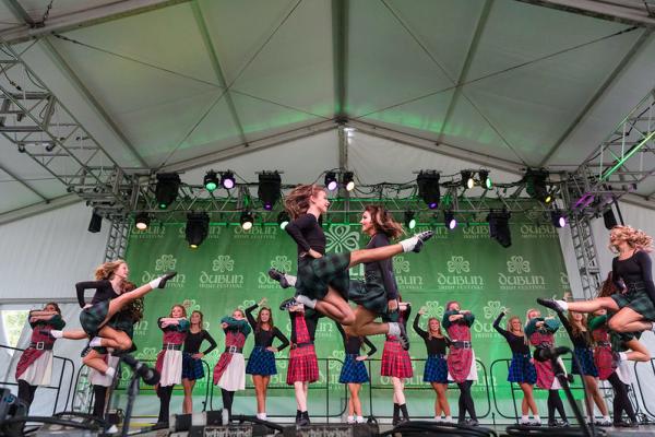 Irish Dancers mid-air performing at the Dublin Irish Festival