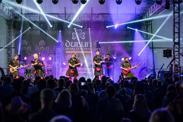The Red Hot Chili Pipers performing in front of a crowd at the Dublin Irish Festival