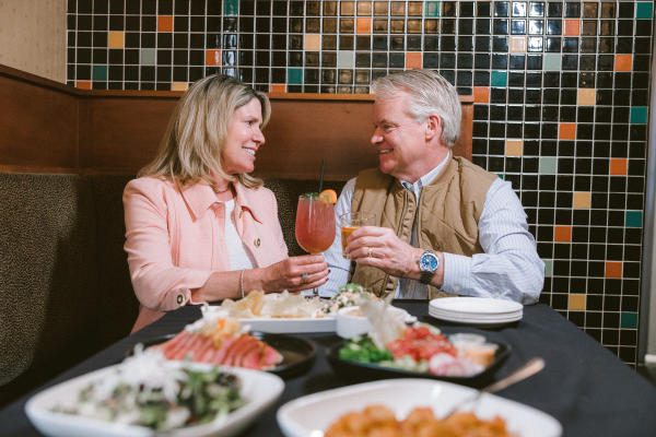 A couple enjoying dinner and cocktails at J. Liu Dublin.