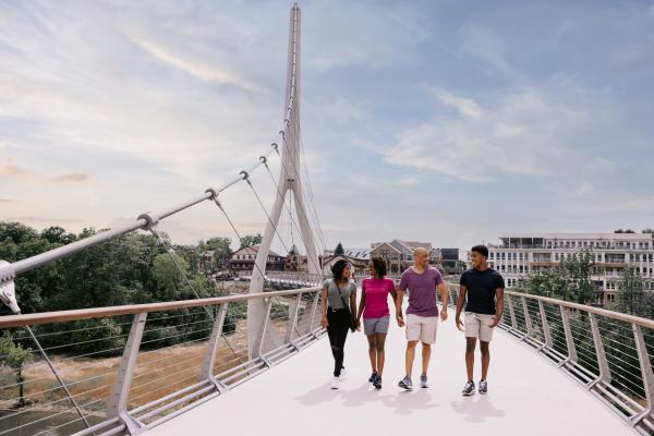 Family walking across the Dublin Link pedestrian bridge