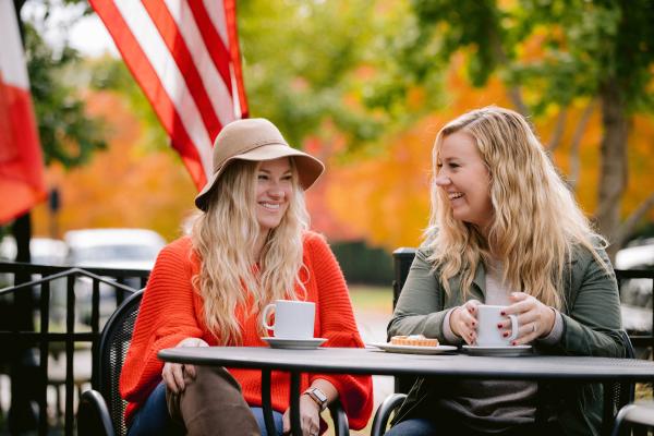 Two girls enjoying coffee on the La Chatelaine patio in Historic Dublin