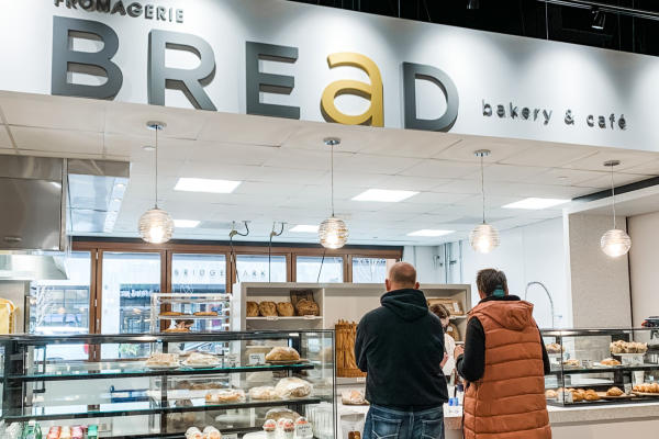 Two adults ordering from Bread Bakery in North Market Bridge Park