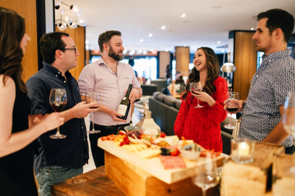 Wine Down Wednesday Le Meridien Women and Men Laughing