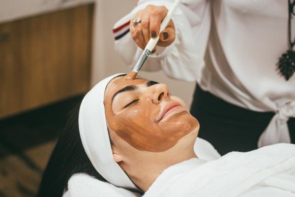 A woman getting a face mask