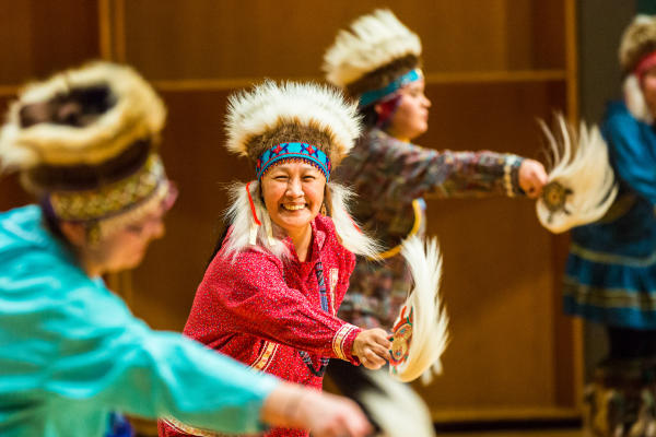 performing native alaska man performing in traditional regalia