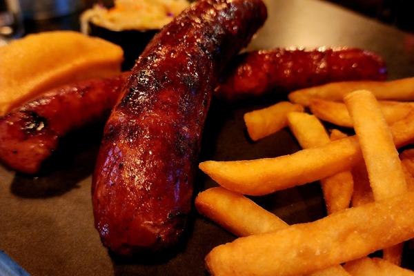 2 double barrel sausage links served with french fries