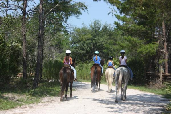 Girls ride horses at Florida Agricultural Legacy Learning Museum.