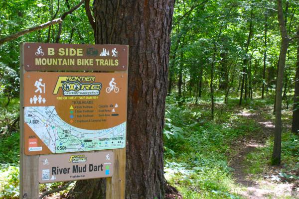 A trailhead marks the B-Side entrance of a mountain bike trail at Springhill Park.