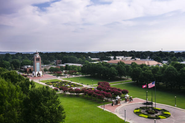 A photo of the green and clock tower with an overcast sky at the University of Arkansas—Fort Smith
