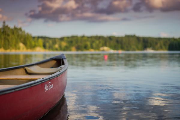 sunset view of lake by canoe