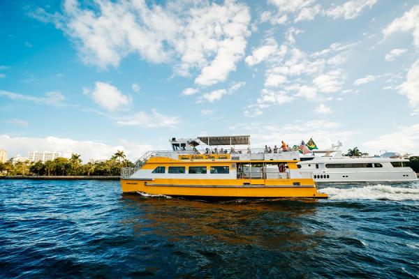 A yellow water taxi in Fort Lauderdale, FL