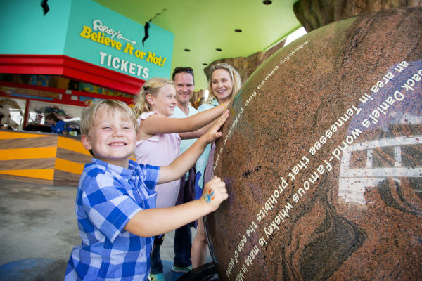 A group of children interact with a display at Ripley's Believe it or Not!