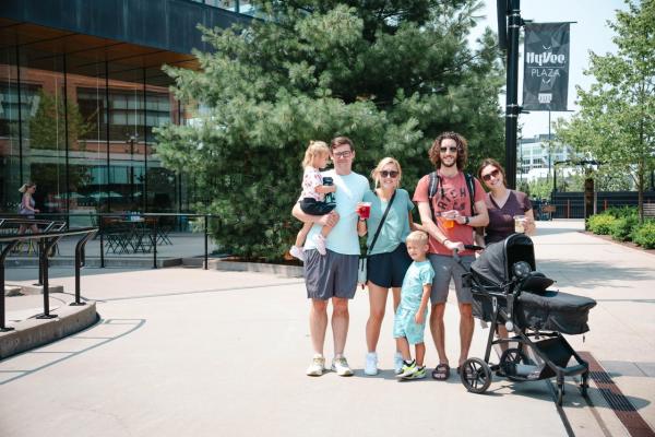 Family posing near the sledding hill at titletown in Green Bay, Wisconsin.