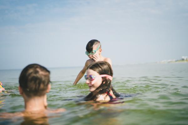 kids swimming in the gulf waters