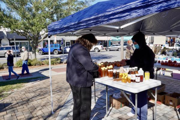 honey stand at farmer's market