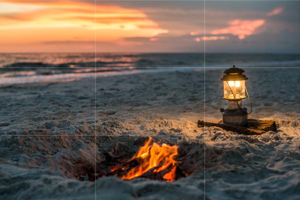 Cozy beach bonfire glowing at sunset along the Gulf County shoreline.